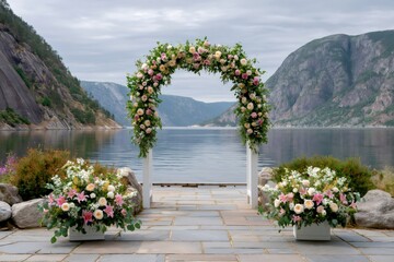 Fototapeta premium Wedding arch floral arrangement overlooking a Norway fjord