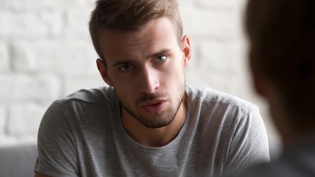 Focused Conversation: A man, engaged in an earnest dialogue, with a subtle display of concern and interest, conveying an atmosphere of sincere communication.