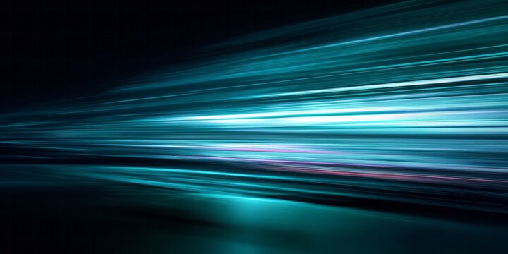 Streaks of bright turquoise light blur into the darkness at high speed.