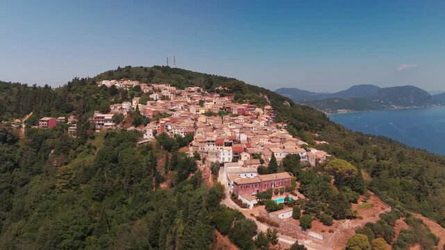 Aerial Boomerang Orbit of Chlomos Village with North Corfu Coastline and Ionian Sea Views