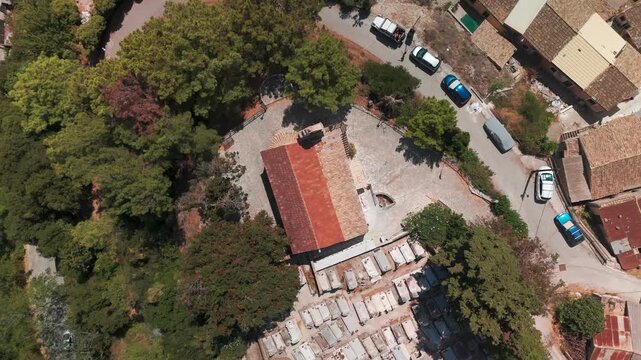 Spiraling Top Down Drone View of Church of the Archangels in Chlomos Village Corfu