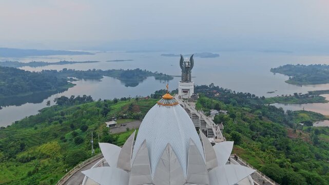 Aerial view of Al-Kamil mosque and kujang kembar monument overlooking jatigede dam