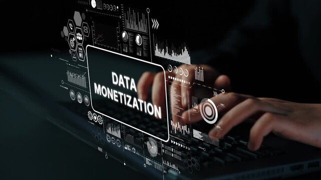 Hands Typing on Laptop with Digital Overlay of Data Monetization Concept and Statistical Graphs for Business Insights. Asymptotic smart data analytic.