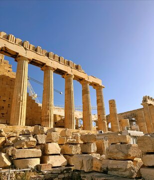 Close up of Parthenon temple over bright blue sky background, Acropolis hill, Athens