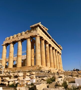 Close up of Parthenon temple over bright blue sky background, Acropolis hill, Athens