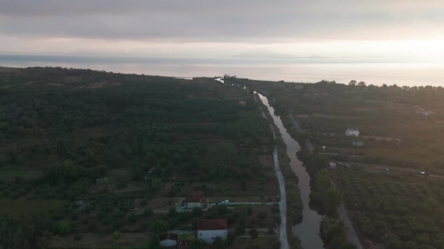 Drone Following Lefkimmi Canal to the Ionian Sea Coastline at Bouka Beach in Corfu