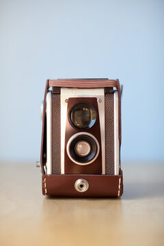 Vintage Camera Brown on blue background