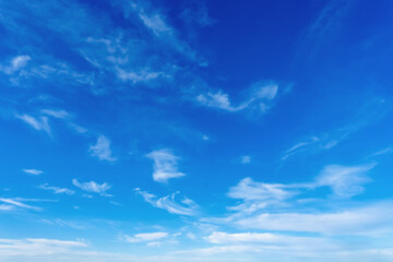 Blue sky with white clouds soft atmospheric background natural skyscape clear weather airy environment minimal scene tranquil daylight backdrop © Dmitrii Labrador