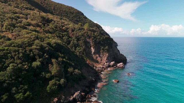 Low Altitude Aerial View Following Rocky Coastline Out to Sea near Ermones Corfu
