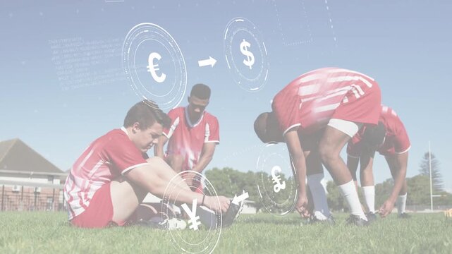 Teenage players sitting and tying cleats on grass, activating finance HUD while preparing for match