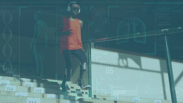 Vertical video: Male teen starting descent on numbered steps for rehab while vitals tracking blades