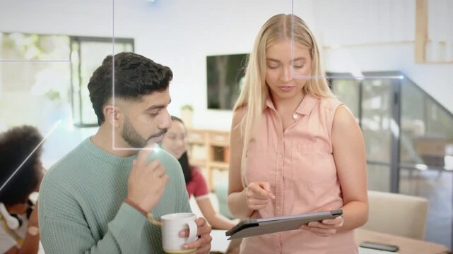 Woman tapping tablet, man holding coffee mug leaning in, overlays guiding business review
