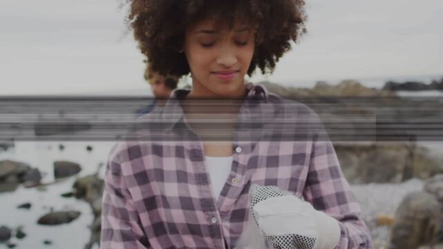 Woman checking red sponge, preparing cleanup while man picking bottle, glitches crossing frame