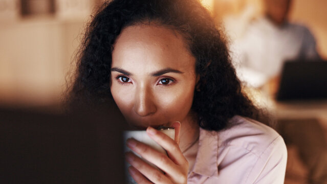 Drinking, coffee and businesswoman with computer in office, working late and risk management on web. Treasury manager, online and person with tea at night, reading or financial evaluation in business