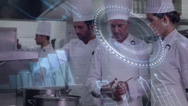 Head chef sampling stockpot, gesturing and instructing sous chef in restaurant kitchen with HUD