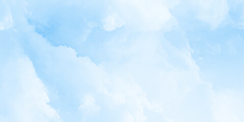 Fototapeta premium A vibrant shot of the blue sky filled with large fluffy white cumulus clouds suggesting fair weather and an open bright day