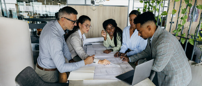 Strategy workshop by diverse leadership team white, black, asian