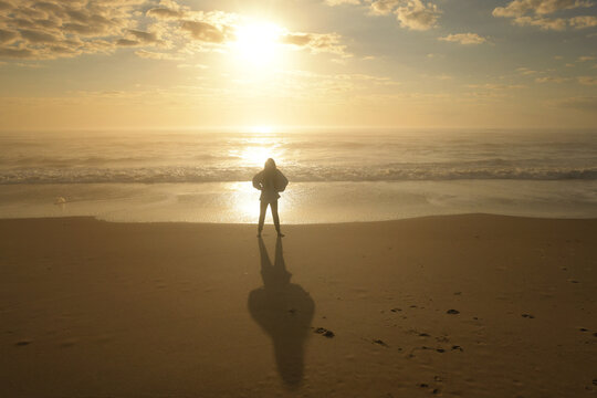Young girl and shadow beach sunrise Cape Hatteras National Seash