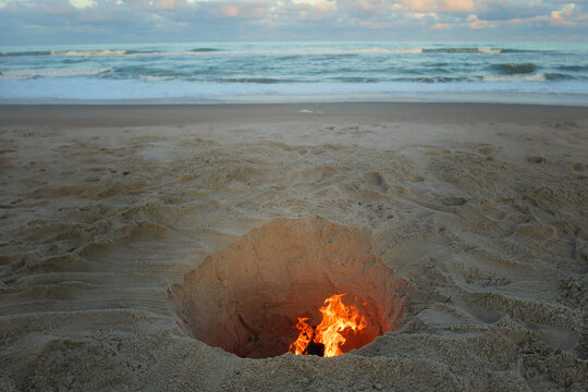 Bright orange camp fire on beach Cape Hatteras National Seashore