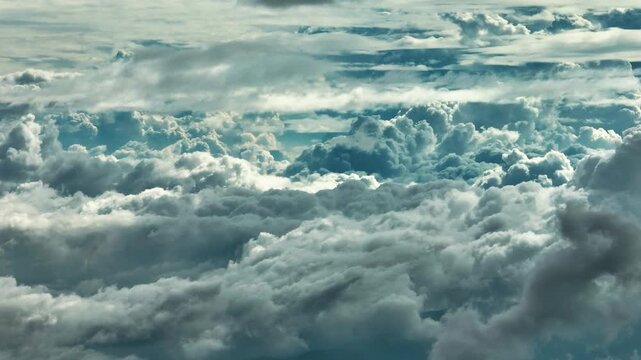 Aerial views of the sunlight with clouds. Flying above the clouds