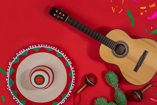 Mexican Independence Day and Cinco de Mayo concept. Background with sombrero, maracas, guitar for greeting card, invitation, advertising.