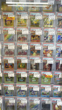 Hamburg, Germany - 04042026: retail display of Pok&eacute;mon trading cards inside a Japanese hobby shop. The image shows neatly arranged single cards in protective sleeves.