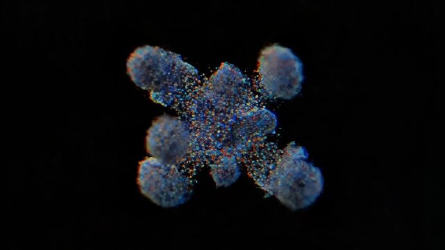 Abstract microscopic structure with glowing particles dissolving against a dark background