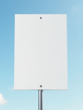 A simple sign with a blank space on a metal pole against a clear blue sky, perfect for use in outdoor settings or as a placeholder graphic