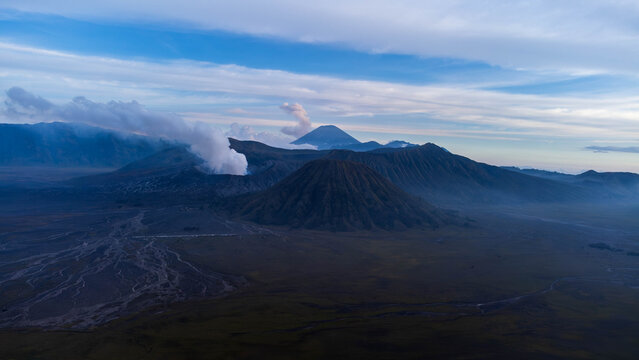 Mount Bromo Active Volcano with Smoke and Mountain Landscape at Sunrise East Java Indonesia