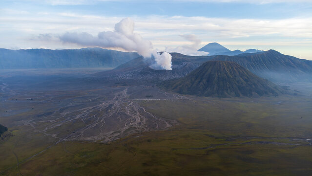 Mount Bromo Active Volcano with Smoke and Batok Mountain Landscape East Java Indonesia