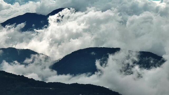 Aerial view misty foggy mountain landscape with tropical rain forest