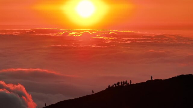 Aerial view above the sea of ​​clouds with the sunset