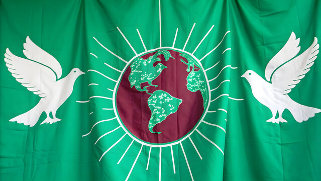 Green flag with white doves and globe symbol