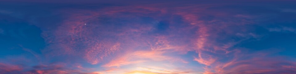 Sunset sky clouds panorama of colorful twilight sky with pink and purple clouds during a vibrant sunset over the horizon © svetograph