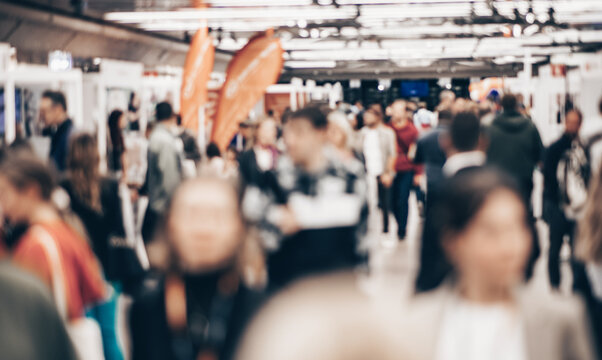 Abstract blurred people at exhibition hall of expo event trade show. Business convention show or job fair. Business concept background
