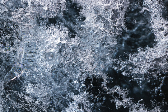 View of the intricate crystalline structures and air bubbles trapped inside the ancient glacial ice of Svinafellsjokull Sveitarfelagid Hornafjordur, Iceland.