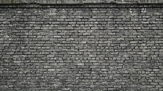 Grey weathered brick wall exterior with aged mortar, crumbling texture, natural daylight, full-frame flat architectural surface photograph.