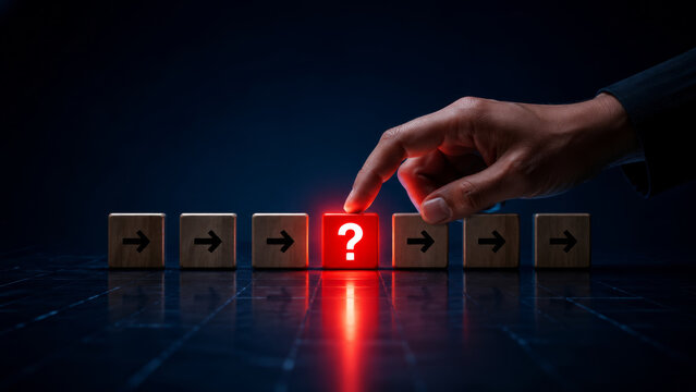 Leadership involves choosing direction in uncertainty as hand points to glowing question mark block among arrow blocks symbolizing decision making and risk management