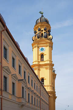 tower of Theatinerkirche, baroque theatine church at odeonsplatz munich, blue sky.