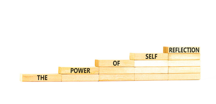 Self reflection symbol. Concept words The power of self reflection on beautiful wooden blocks. Beautiful white paper background. Business the power of self reflection concept. Copy space.