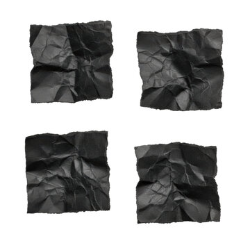 Four squares of black construction paper with torn edges and crumpled textures arranged in a scattered composition on a white background, minimalist abstract design