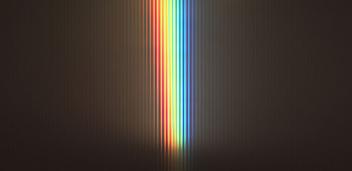 vibrant vertical light beam with rainbow colors glowing in dark smoky atmosphere © PixelCraft Studio
