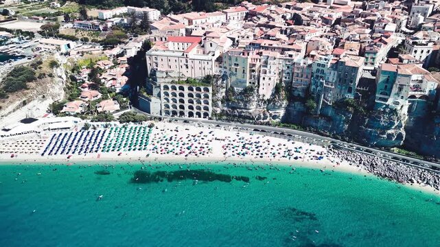 Drone perspective of Tropea in summer showing turquoise sea and scenic coastal landscape