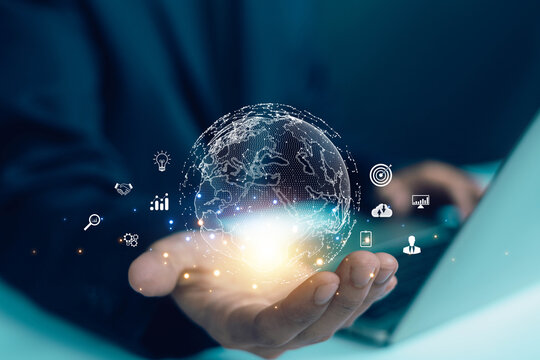 Digital global network concept with glowing earth hologram in hand, symbolizing technology, data, innovation, communication, and business analytics in modern digital transformation era.