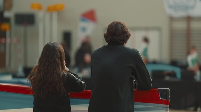 People watching a gymnastics competition indoors