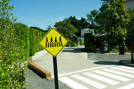 Yellow Traffic signs,sign symbolizes a school crossing zone,Pedestrian crossing,Directional, Traffic symbols,Zebra crossing concept.