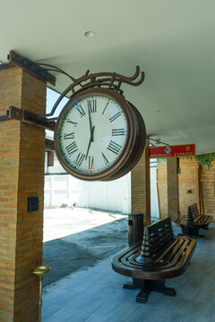 Retro Large decorative clock hanging from a train station,vintage old style,classic public clock in railway station subway central train station, watch time waiting train concept.