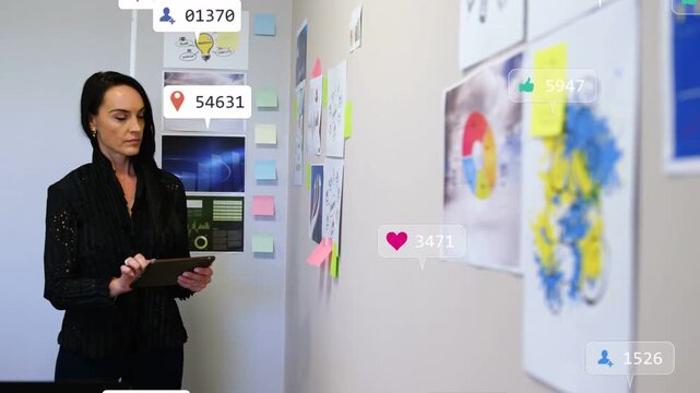 Mature woman tapping tablet, starting floating notifications swelling over charts, correlating data