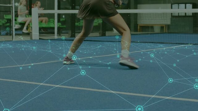 Woman player shifting weight and doing side steps on sports court, overlay tracking feet for hit