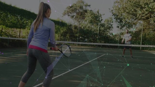 Woman stepping forward hitting incoming ball, man reacting in sports rally particle-shape overlay